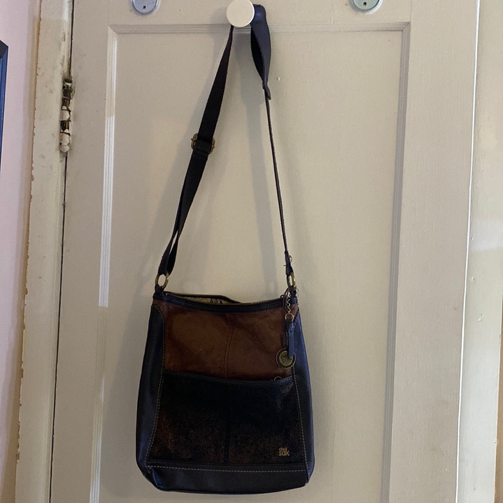 The Sak medium brown leather purse.